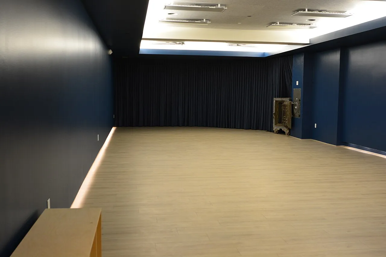 A quiet, empty room with soft overhead light